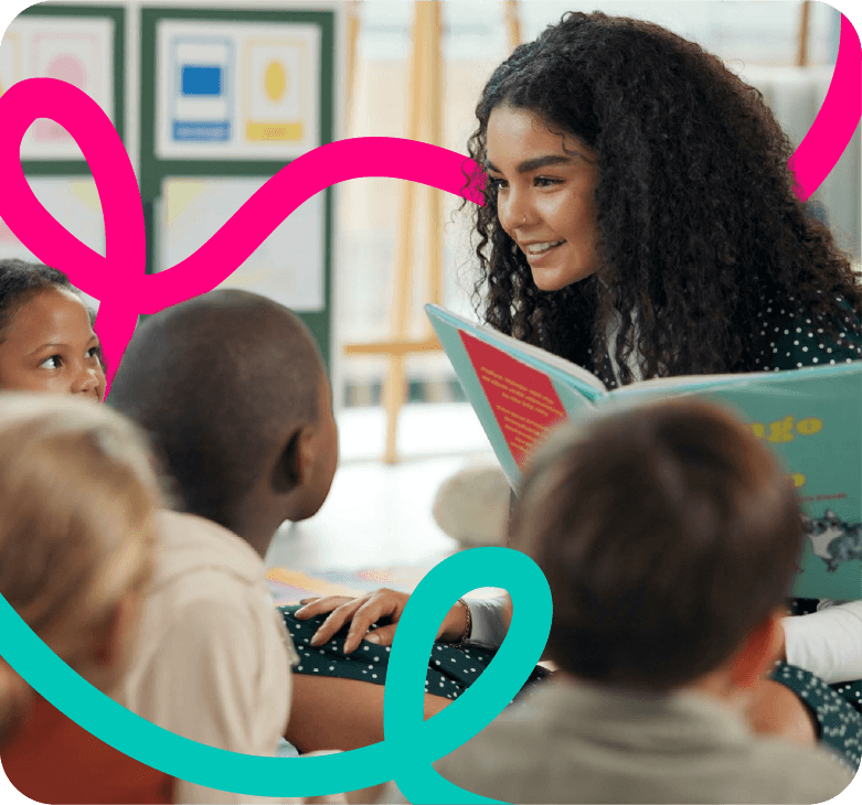 A teacher reading a picture book to a group of young students